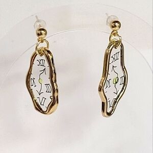 Salvatore Dali melted watch earrings in gold or silver frame.